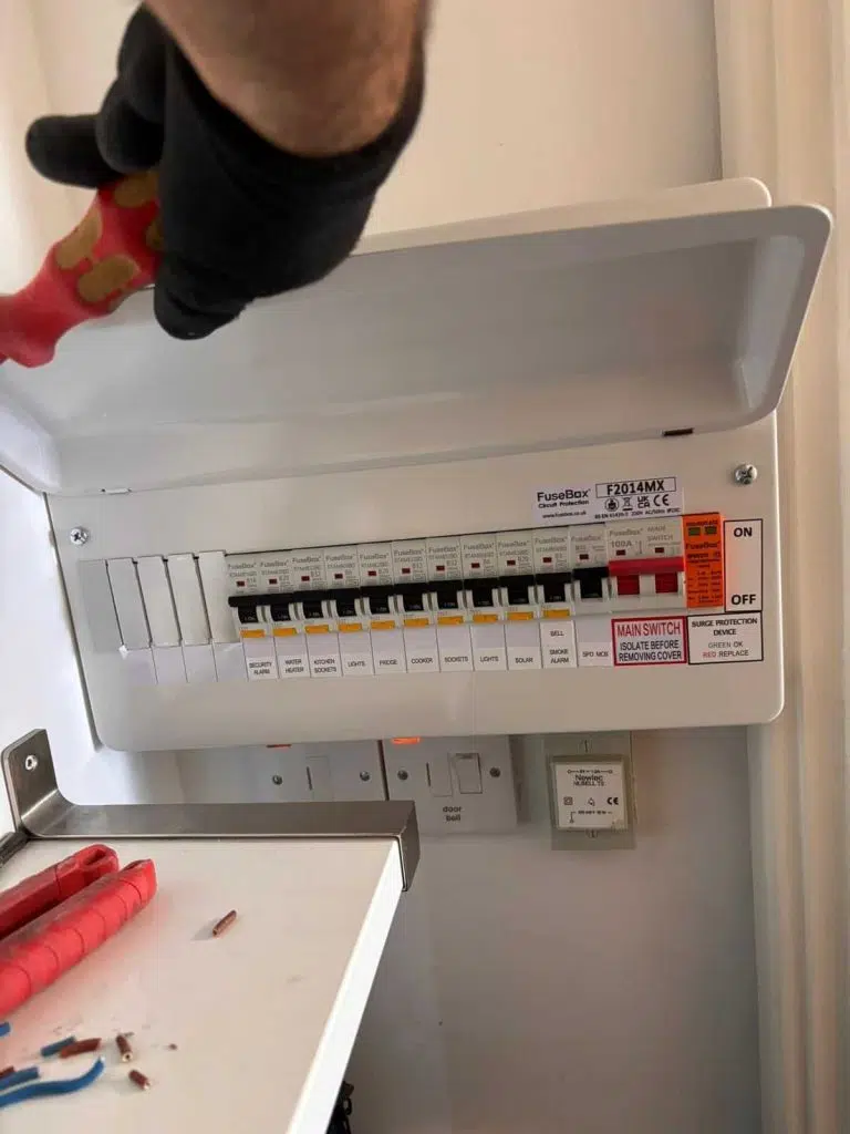 Electrician carrying out EICR inspection in Notting Hill Gate property