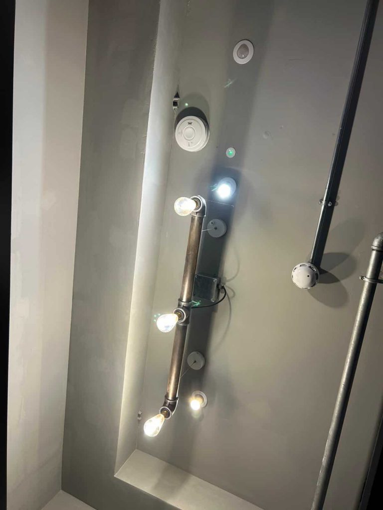 Certified electricians upgrading communal lighting in North London property