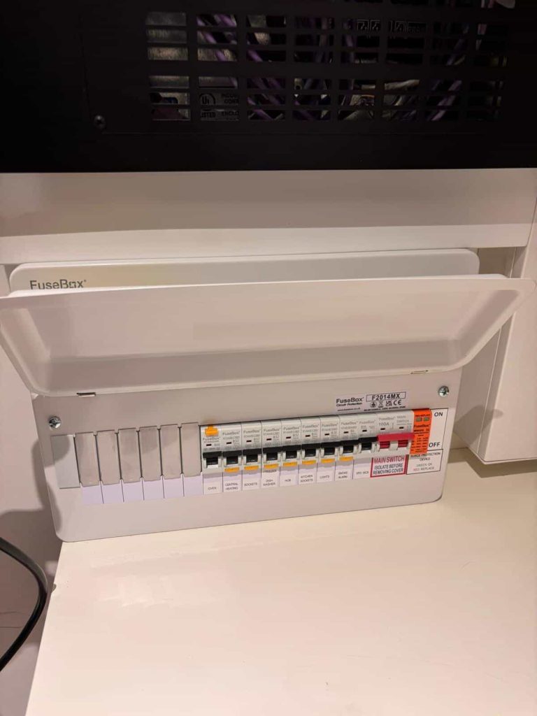 Electrician carrying out EICR inspection in Notting Hill Gate property