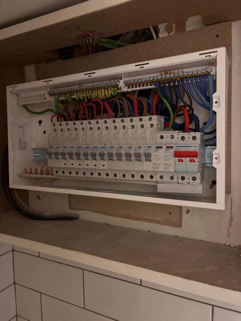 Electricians4London team testing upgraded electrical system in Chelsea