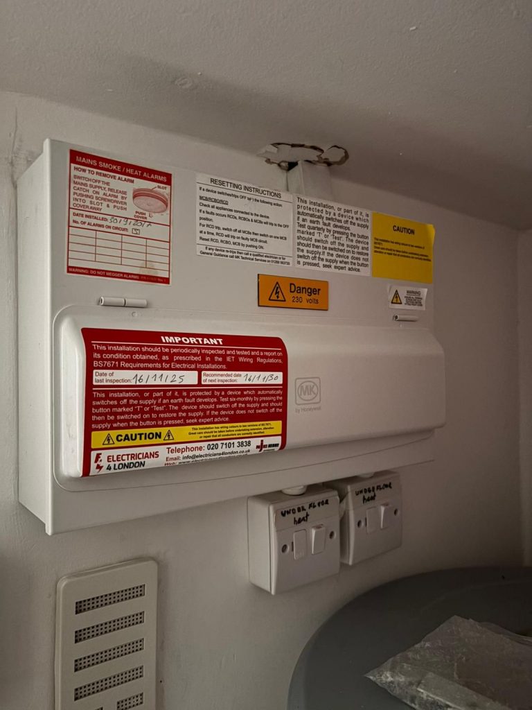 Electrician installing LED spotlights in Hampstead Heath NW home