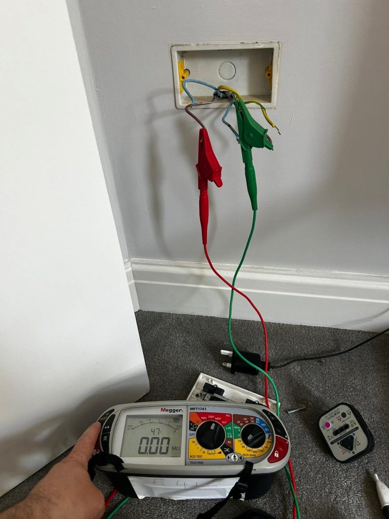 Professional insulation resistance testing using a Megger tester to diagnose a damaged electrical cable causing an RCBO to trip.